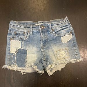 Blue patched Jean shorts from contraband.